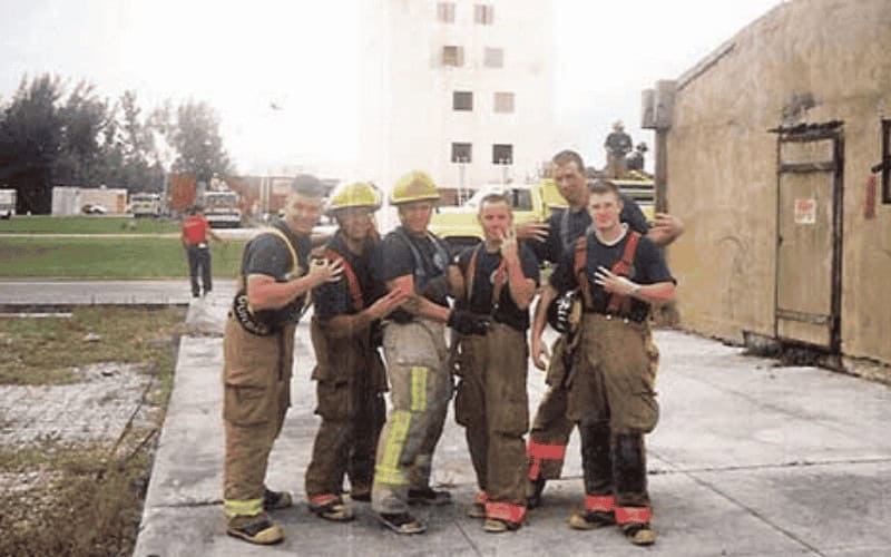 Sean Kaptaine in firefighter gear with Davie Fire Rescue crew – Kap Tree Service owner